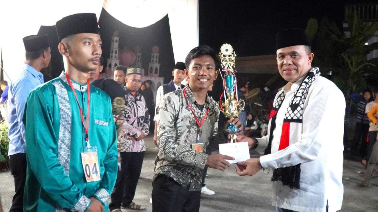 Teks Foto/Beritasore/ist   Pj Bupati Langkat H. M. Faisal Hasrimy, AP., M.AP hadiri Festival Beduk dan Pawai Obor di Kecamatan Sei Lepan, Minggu (16/6/24)malam.