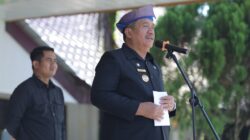 Bupati Asahan Gunakan Tanjak Melayu Pimpin Peringatan Hardiknas